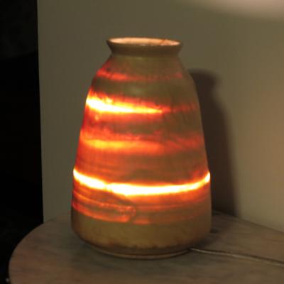 Lampada in acero alta cm. 24 , accesa.